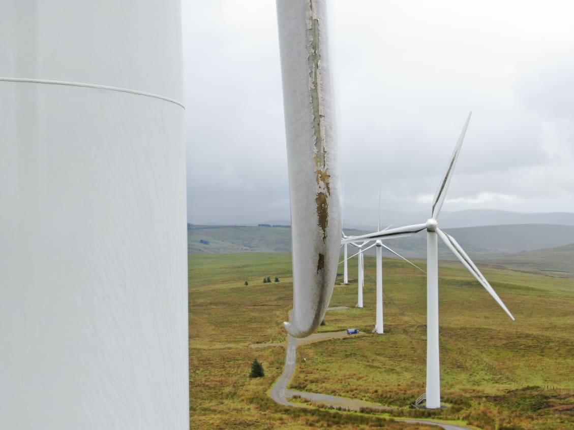 WTG blade being inspected with a Wind Turbine Inspection UAV on a hill in Ireland