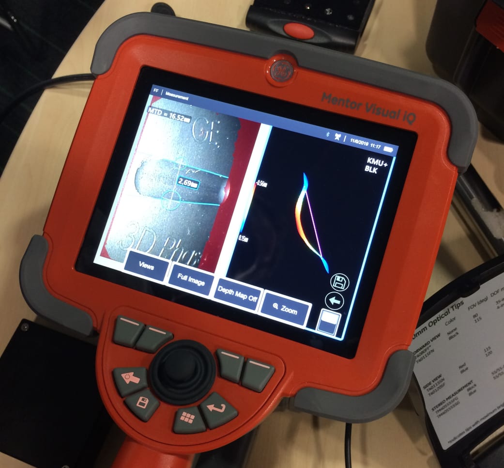 A borescope being used on a wind turbine gearbox inspection